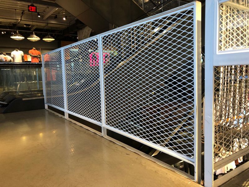Flattened Expanded Metalis used as Infill Panels for the upper level of a retail store.