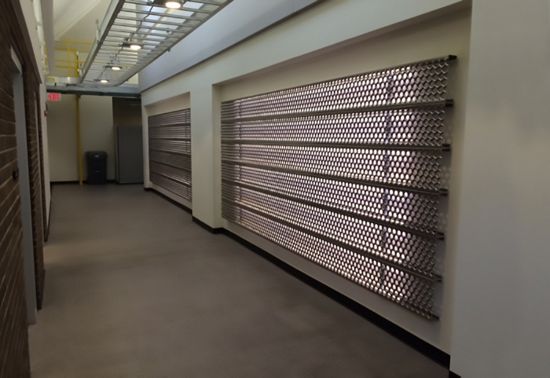 McNICHOLS PERF-O GRIP Plank Grating hangs in the showroom of a company's headquarters in Highland, IL