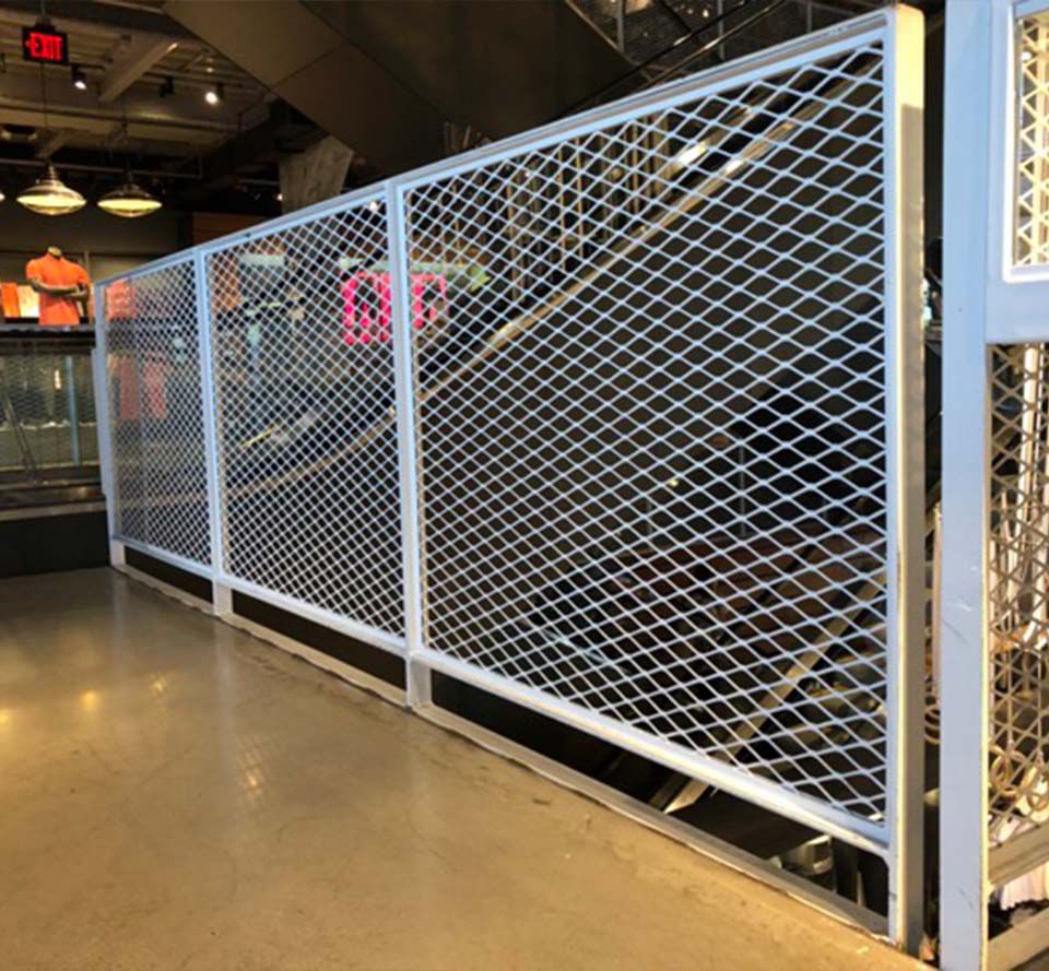 Photo of a barrier inside of a store that is made out of Expanded Metal Infill Panels.