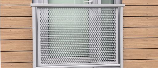 Photo of a glass door and a balcony with a balustrade that has Perforated Metal Infill Panels.