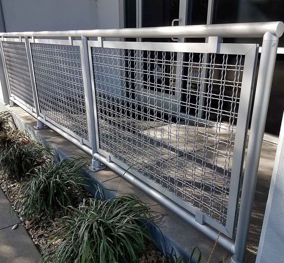 Photo of a first floor balcony that has a balustrade made of Wire Mesh Infill Panels.